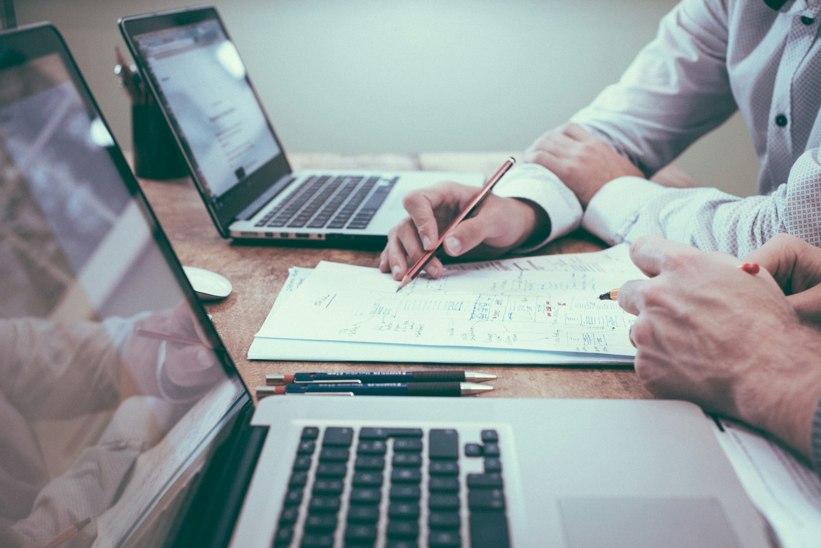 Business and management professionals reviewing data