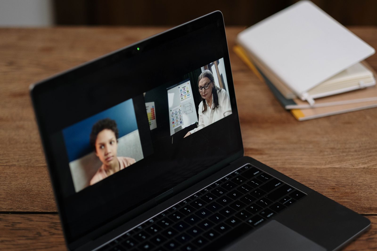 A laptop screen showing a live one-on-one video lesson between an Allin tutor and student